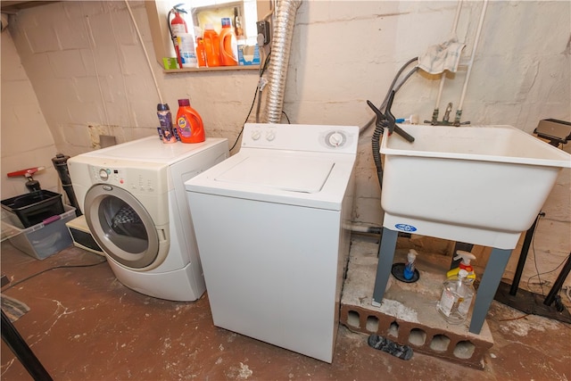 washroom featuring sink and separate washer and dryer