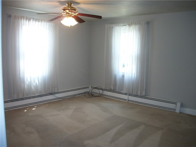 empty room featuring carpet floors and ceiling fan