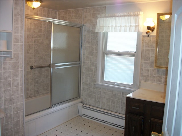 bathroom featuring vanity, a baseboard heating unit, and tile patterned flooring