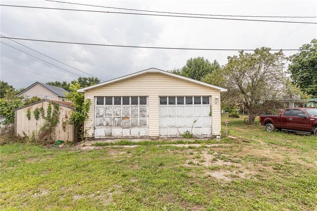 garage with a lawn