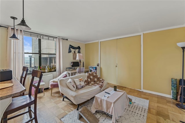 living room with ornamental molding, light parquet floors, and expansive windows