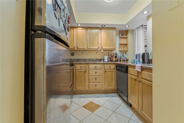 kitchen with light tile patterned flooring, dishwashing machine, stainless steel refrigerator, light brown cabinetry, and a raised ceiling