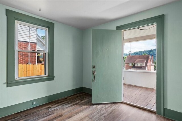 unfurnished room featuring wood-type flooring