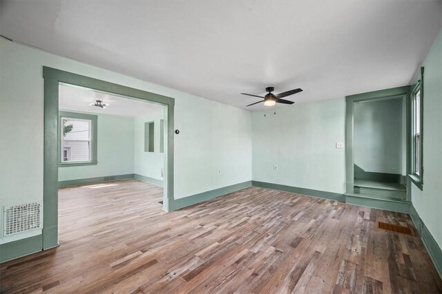 unfurnished room featuring wood-type flooring and ceiling fan