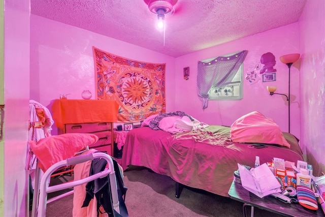 carpeted bedroom with a textured ceiling and ceiling fan