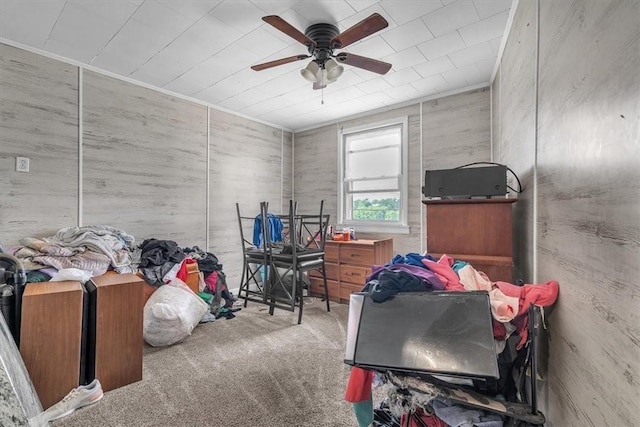 miscellaneous room with carpet flooring and ceiling fan