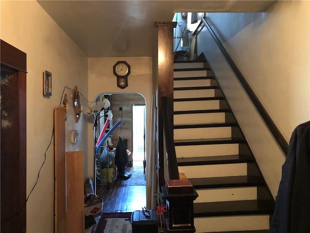 stairs with wood-type flooring