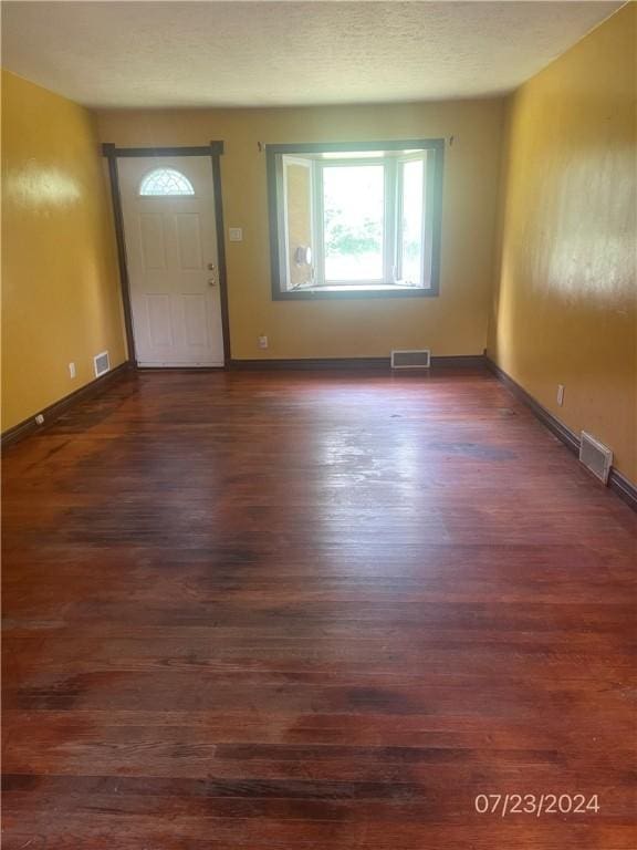 foyer entrance with dark hardwood / wood-style flooring