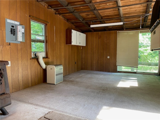 interior space with wood walls and coffered ceiling