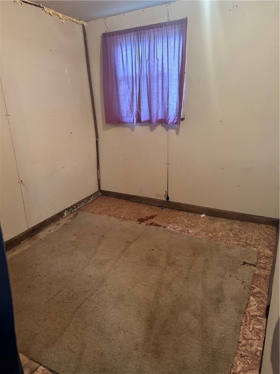 empty room featuring carpet flooring