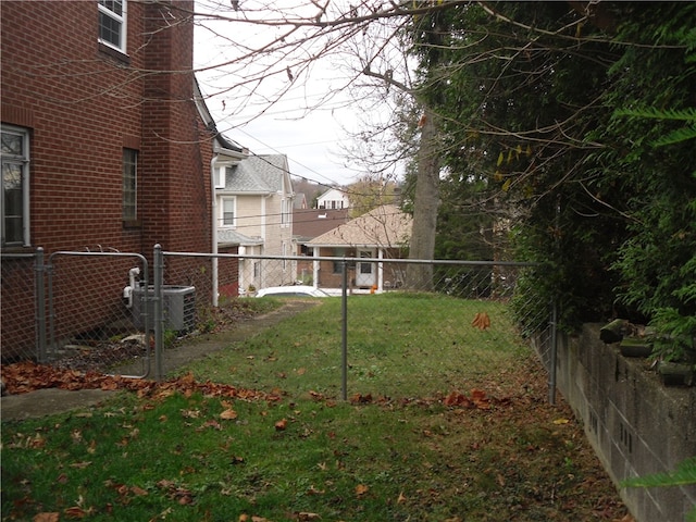 view of yard with central air condition unit