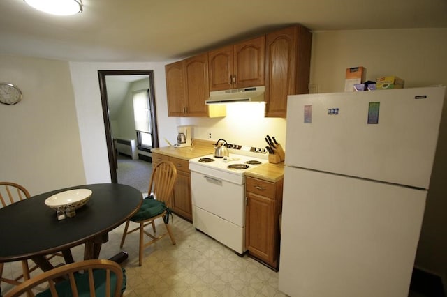 kitchen featuring white appliances and light tile patterned floors