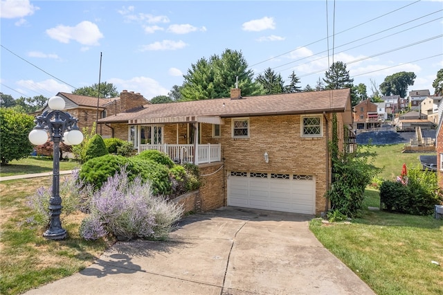 ranch-style home with a garage and a front yard