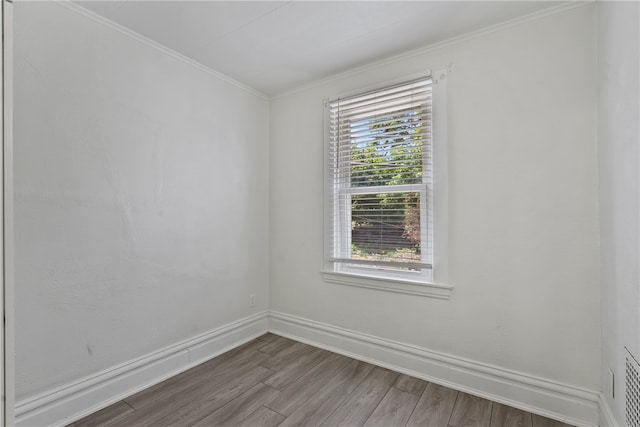 empty room with hardwood / wood-style flooring