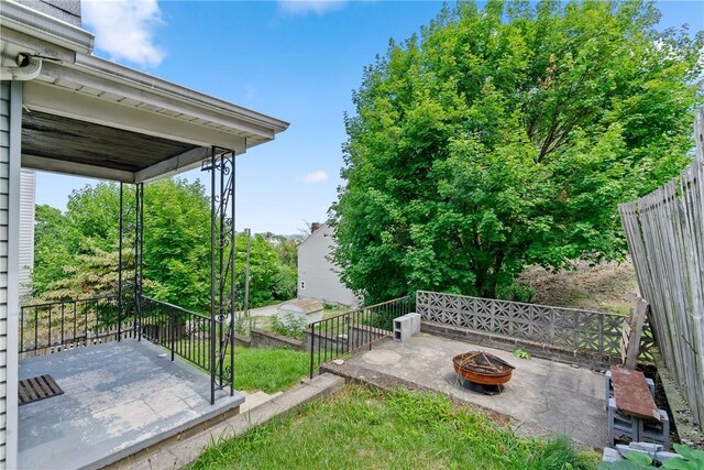 view of yard with an outdoor fire pit