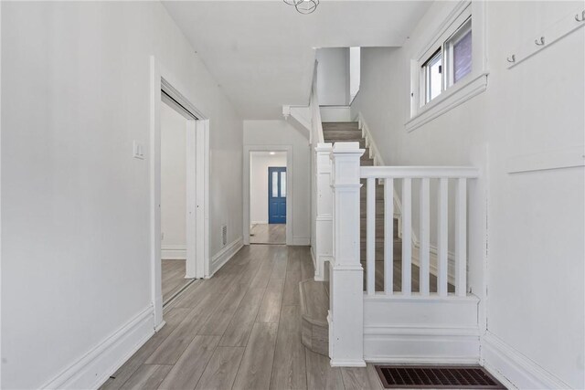 hall with light wood-type flooring