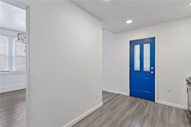 foyer entrance with light wood-type flooring