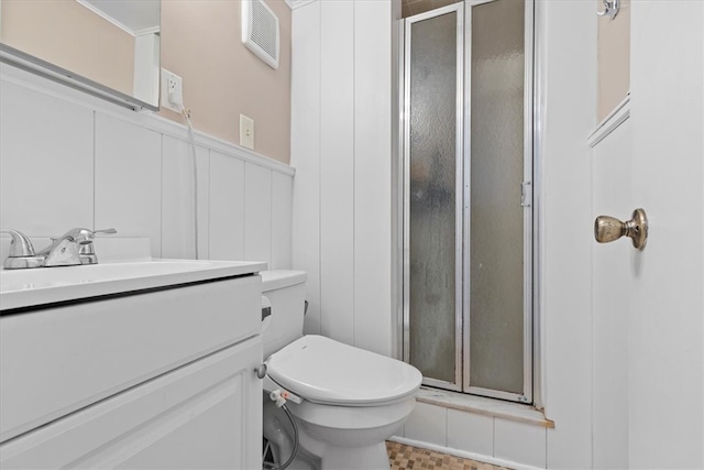 bathroom featuring walk in shower, vanity, and toilet