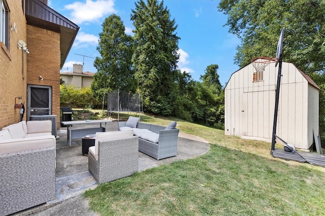 view of yard featuring outdoor lounge area, a patio, a shed, and a trampoline