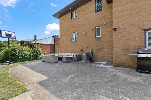 exterior space featuring a patio area, central AC unit, and an outdoor hangout area