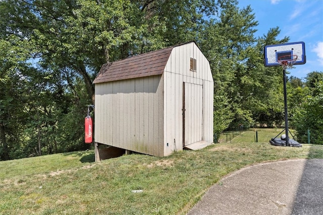 view of outdoor structure featuring a lawn