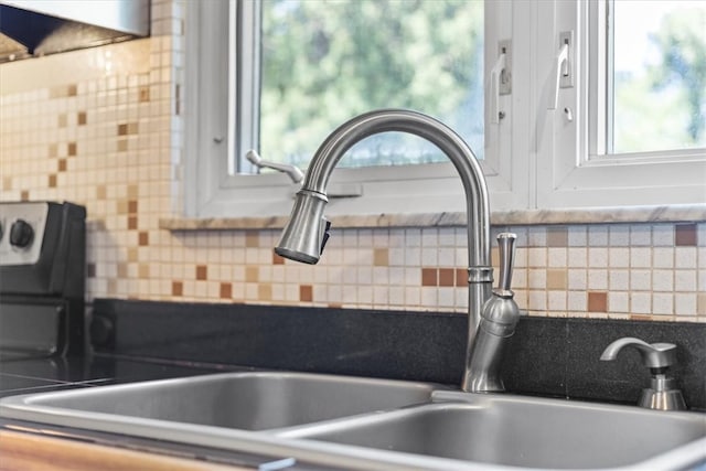 kitchen featuring sink and backsplash