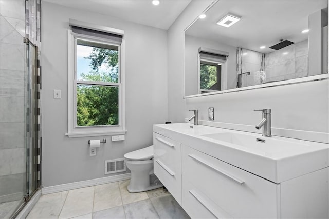 bathroom featuring vanity, toilet, and walk in shower