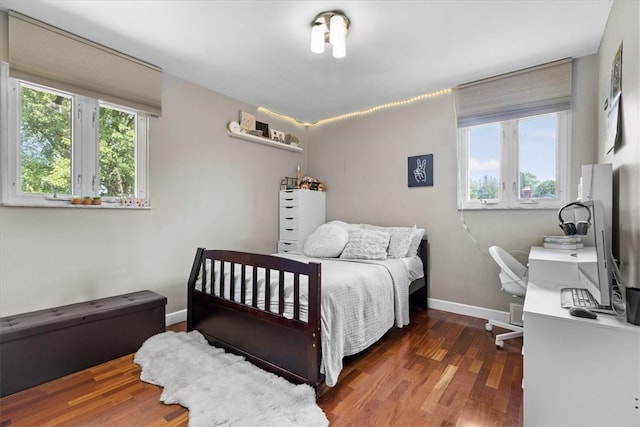 bedroom featuring dark hardwood / wood-style flooring