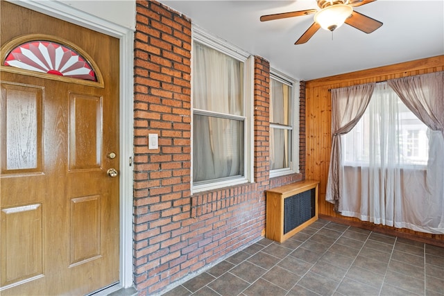 entrance to property with ceiling fan