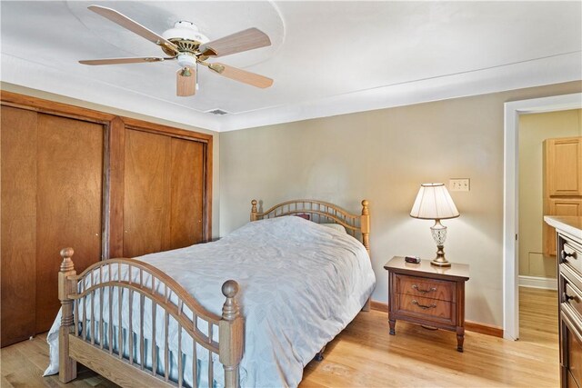 bedroom featuring ceiling fan and light hardwood / wood-style flooring