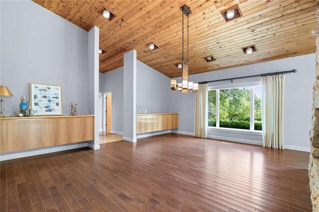 unfurnished living room featuring an inviting chandelier, wooden ceiling, hardwood / wood-style flooring, and high vaulted ceiling