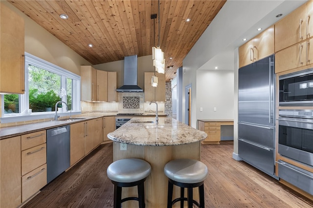 kitchen with appliances with stainless steel finishes, wood ceiling, wood-type flooring, and wall chimney exhaust hood