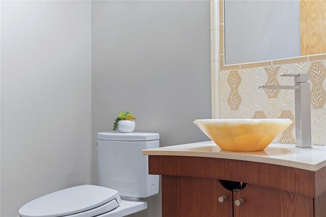 bathroom with vanity and toilet