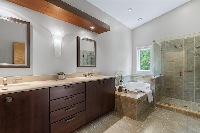 bathroom with double vanity, tile patterned flooring, and independent shower and bath