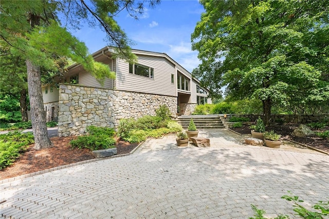 view of side of home with a patio