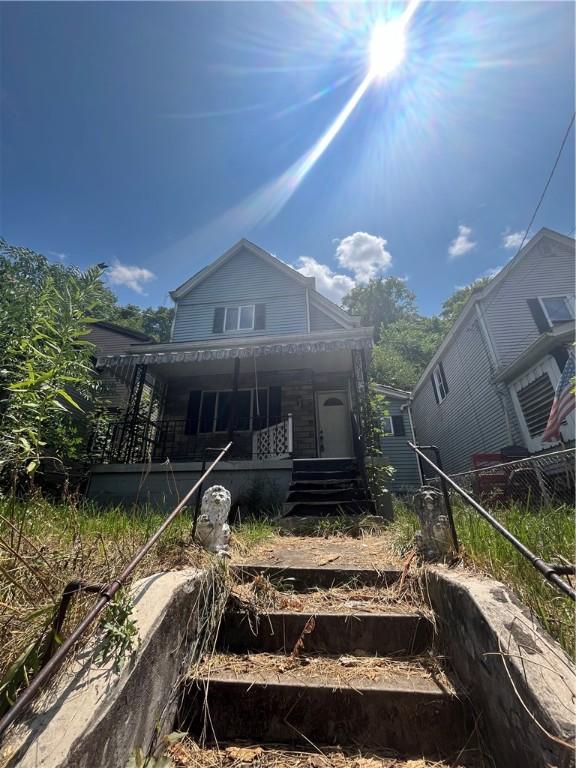 back of house with a porch