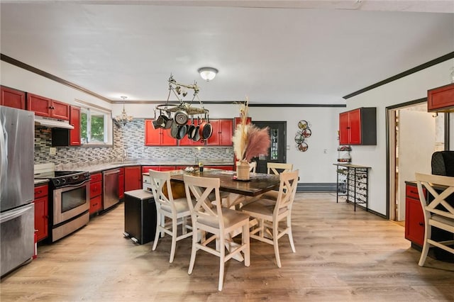 kitchen with stainless steel appliances, light hardwood / wood-style flooring, sink, ornamental molding, and decorative backsplash