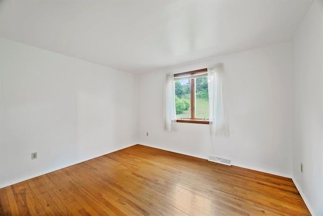 unfurnished room featuring light hardwood / wood-style flooring