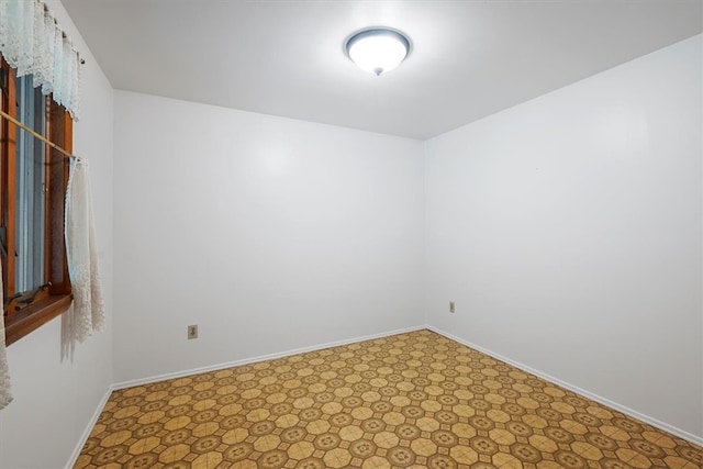 spare room with tile patterned flooring