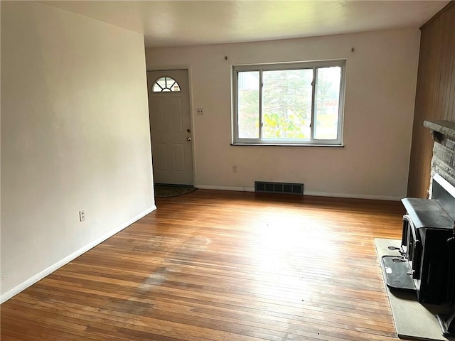 unfurnished living room featuring light hardwood / wood-style flooring