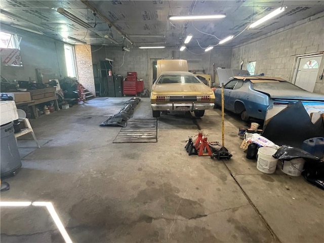 garage featuring concrete block wall