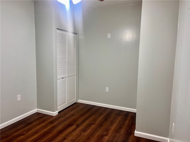 empty room with wood-type flooring and ceiling fan