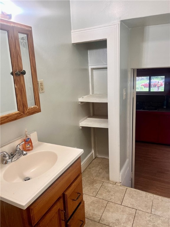 bathroom featuring hardwood / wood-style floors and vanity