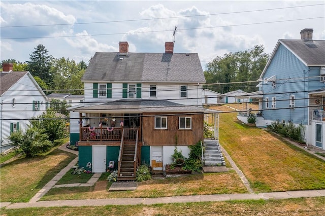 rear view of house with a lawn