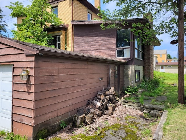 view of home's exterior with a garage