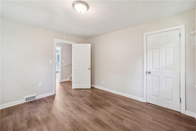 spare room featuring hardwood / wood-style floors