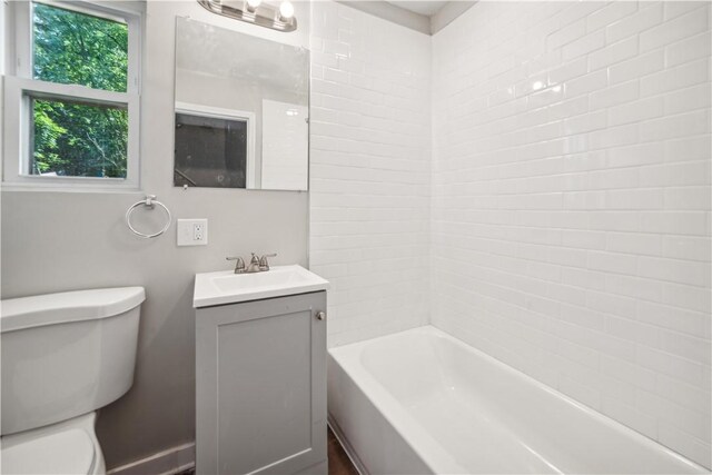 full bathroom featuring shower / tub combination, vanity, and toilet