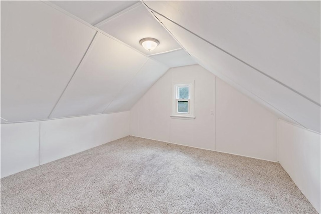 bonus room featuring carpet floors and lofted ceiling