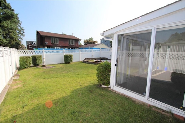 view of yard featuring a sunroom