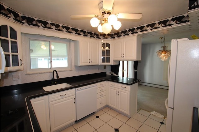 kitchen featuring sink, white cabinetry, white appliances, ceiling fan, and light colored carpet